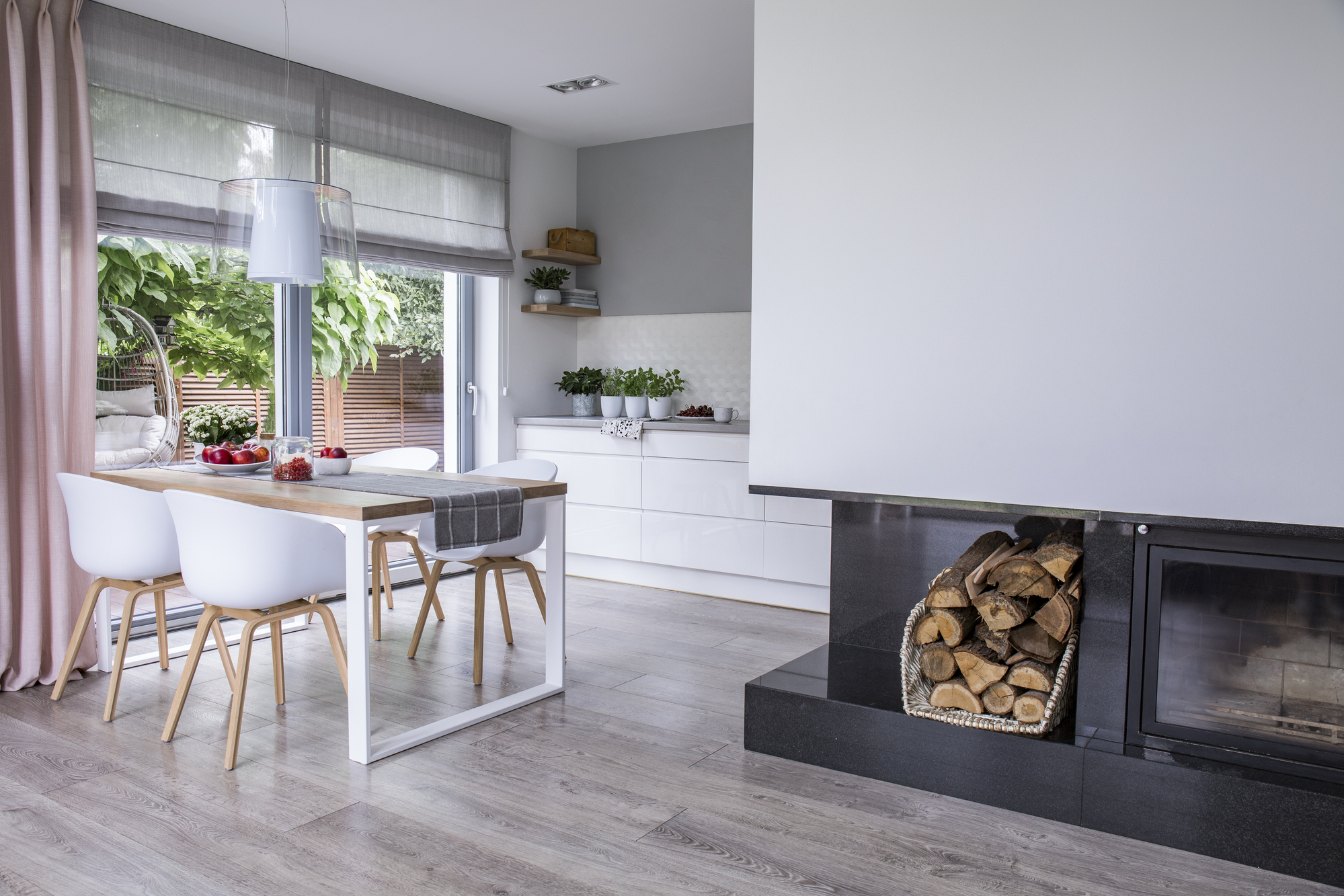Dining area with fireplace and luxury vinyl plank flooring